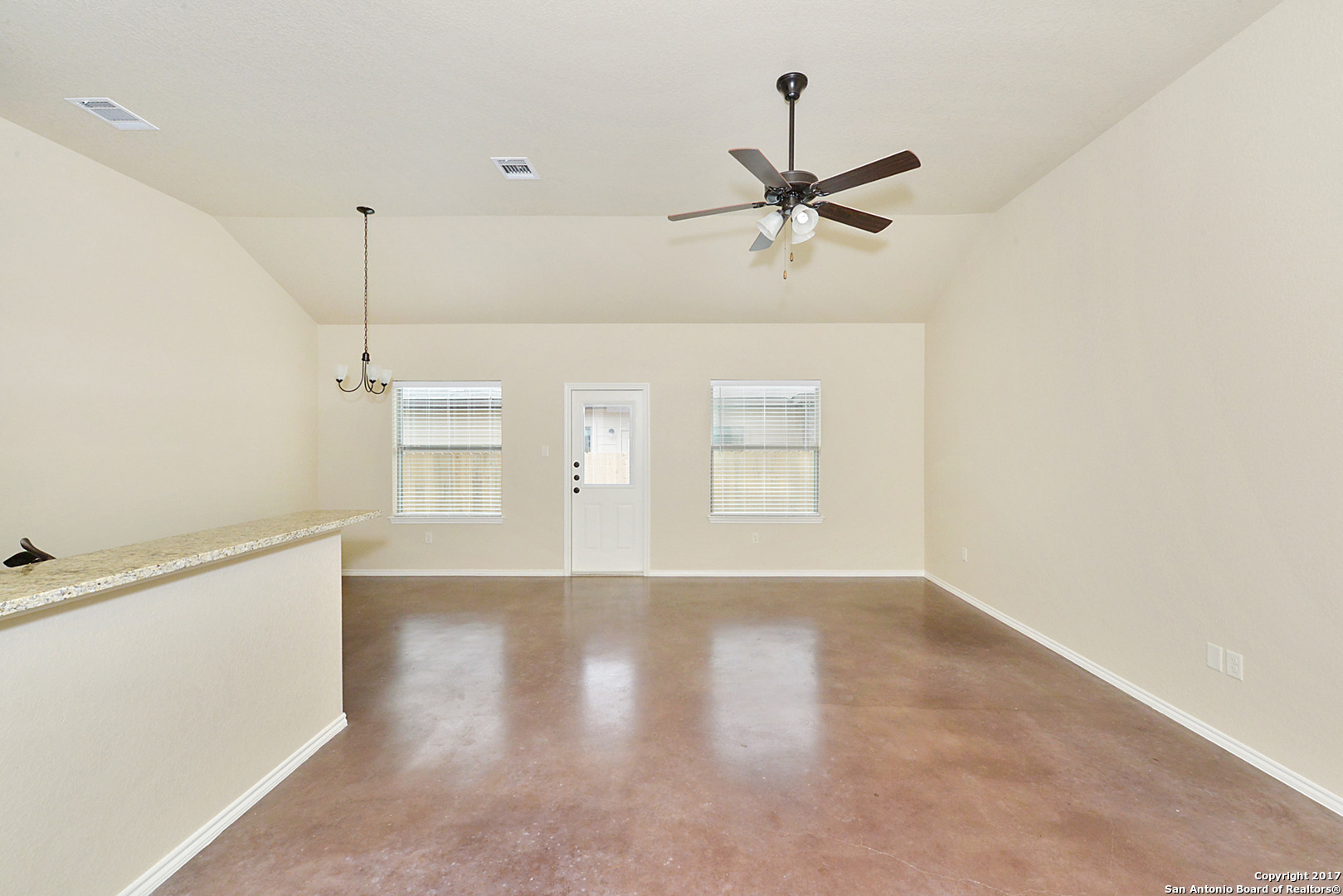 2557 Pahmeyer Road New Braunfels, TX 78130 - Photo 6 of 25 a view of a livingroom with a ceiling fan and hardwood floor