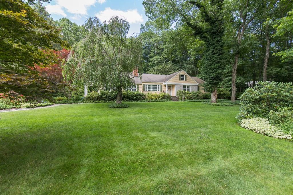 21 Wepawaug Road Woodbridge, CT 06525 - Photo 1 of 1 a front view of a house with a yard