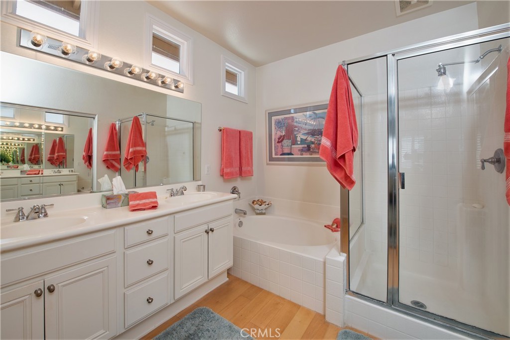 28517 Oasis View Circle Menifee, CA 92584 - Photo 21 of 66 a bathroom with a tub sink and mirror