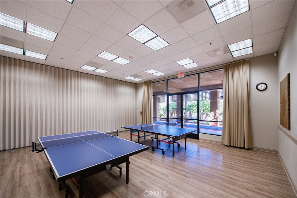 28517 Oasis View Circle Menifee, CA 92584 - Photo 58 of 66 a room with furniture pool table wooden floor and windows