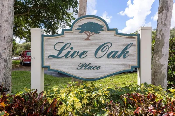a view of a sign board with a house