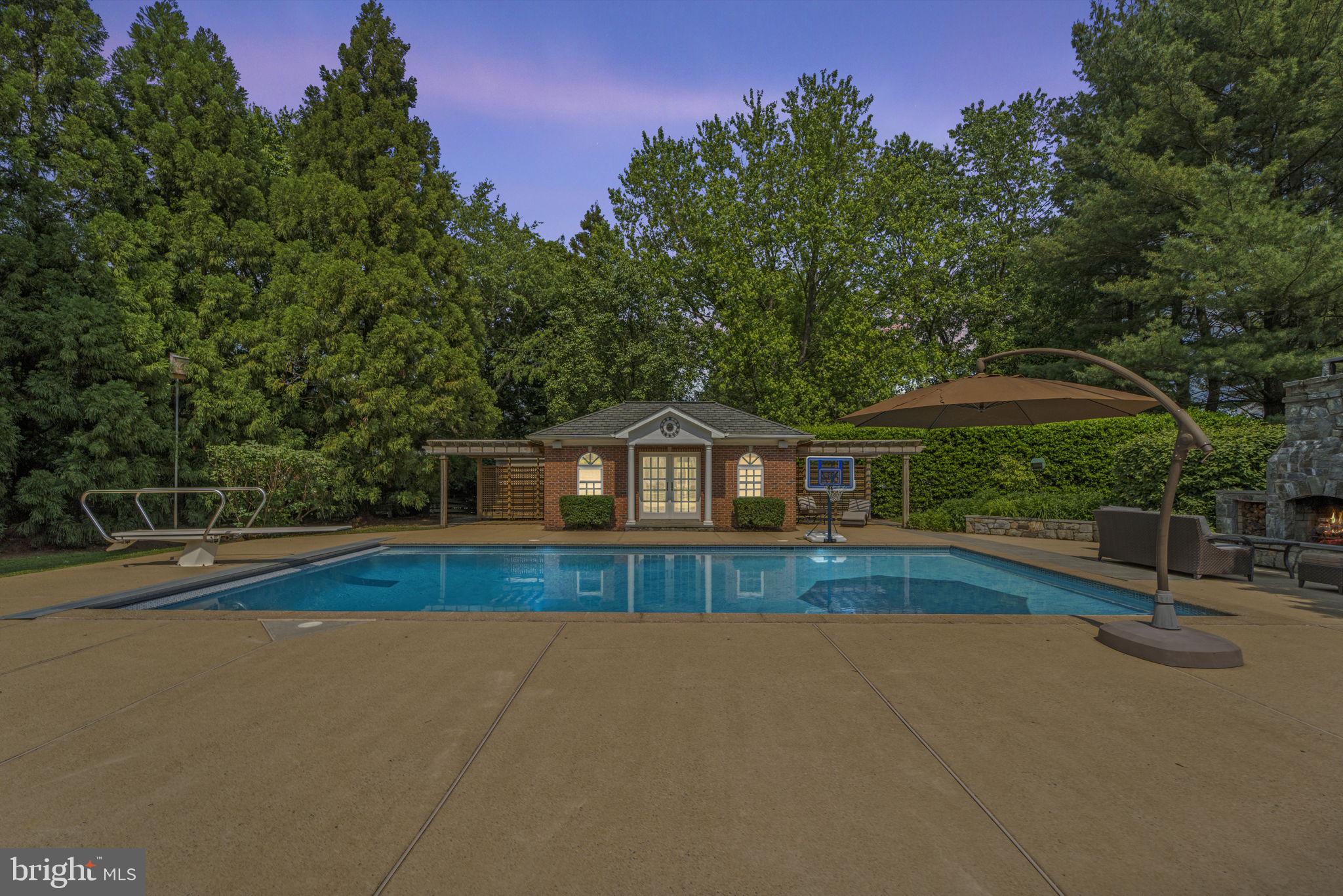 1211 Tottenham Court Reston, VA 20194 - Photo 50 of 80 evening view of pool and poolhouse