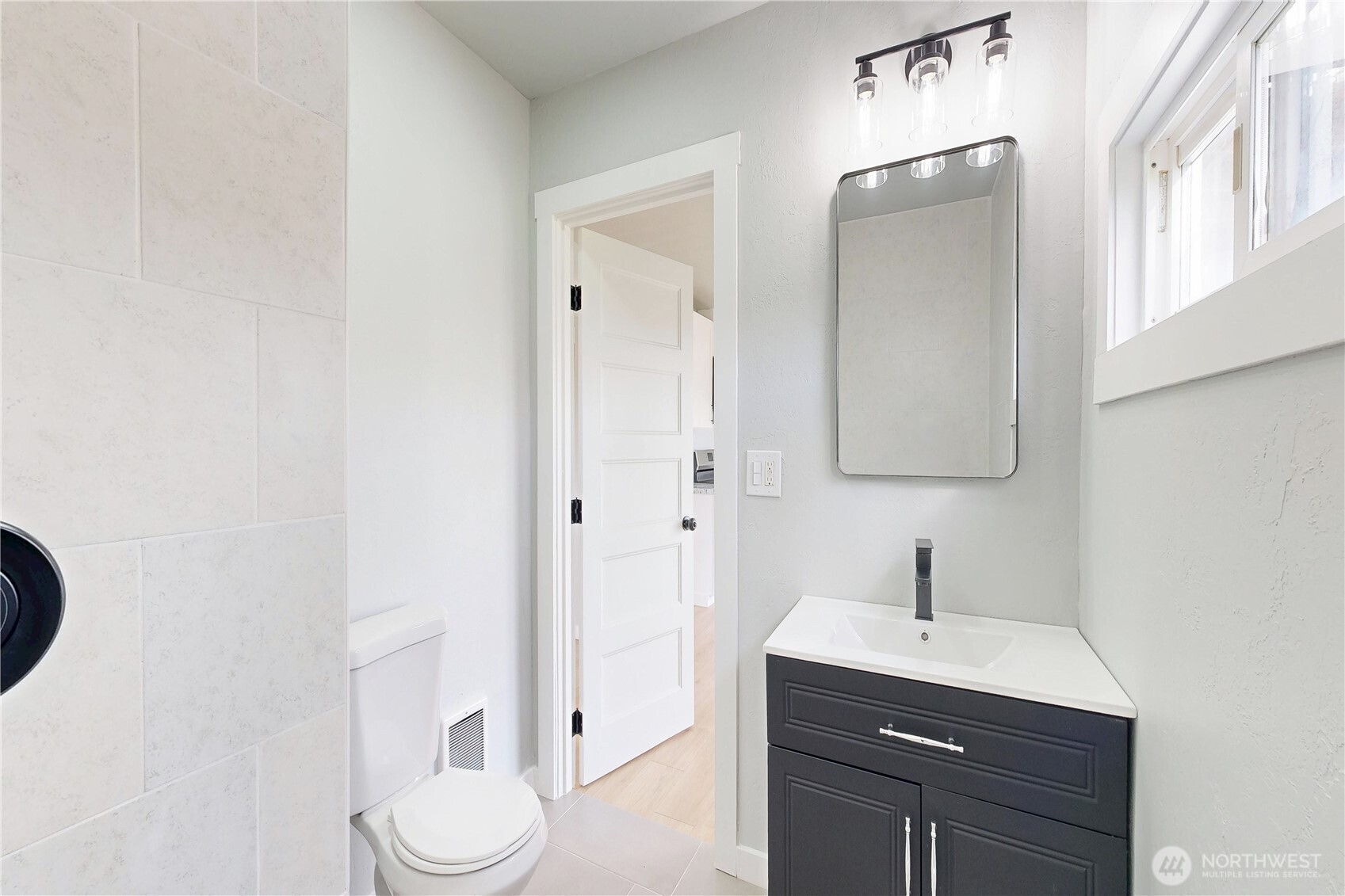 255 College Street Adams, OR 97810 - Photo 17 of 31 a bathroom with a toilet sink a mirror and vanity