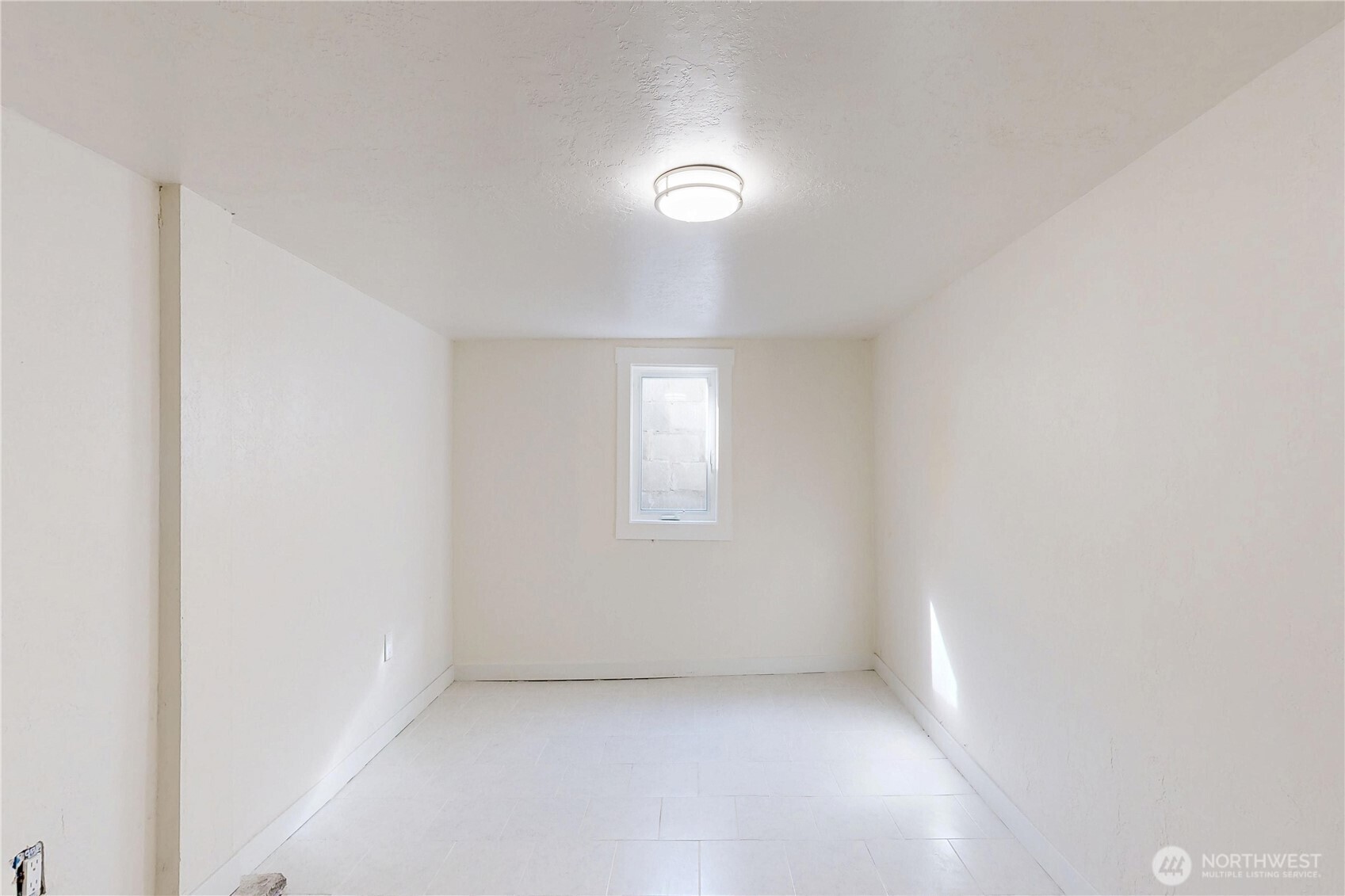 255 College Street Adams, OR 97810 - Photo 20 of 31 an empty room with a empty space and windows