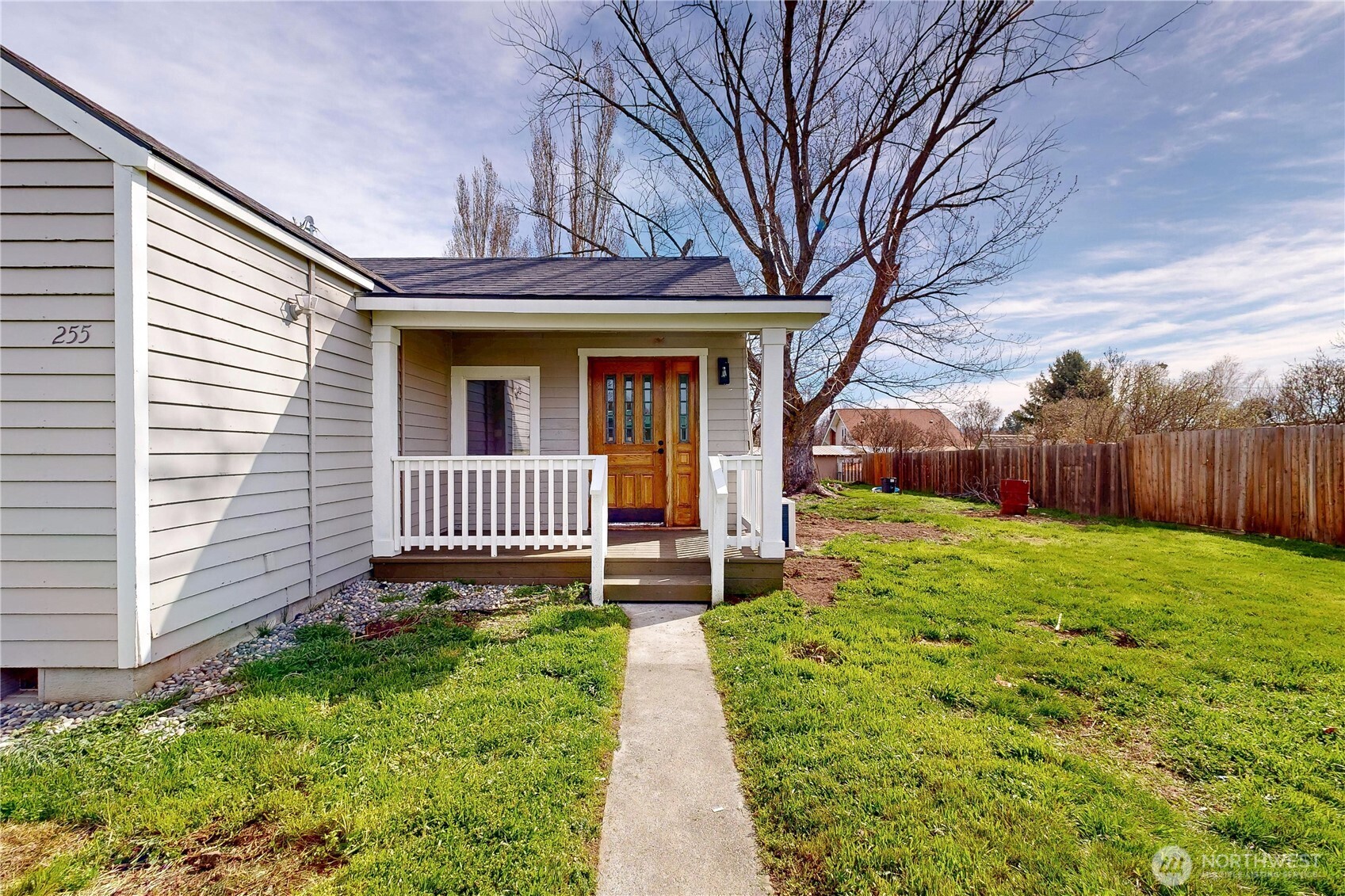 255 College Street Adams, OR 97810 - Photo 28 of 31 a view of a porch with a large window and flower plants