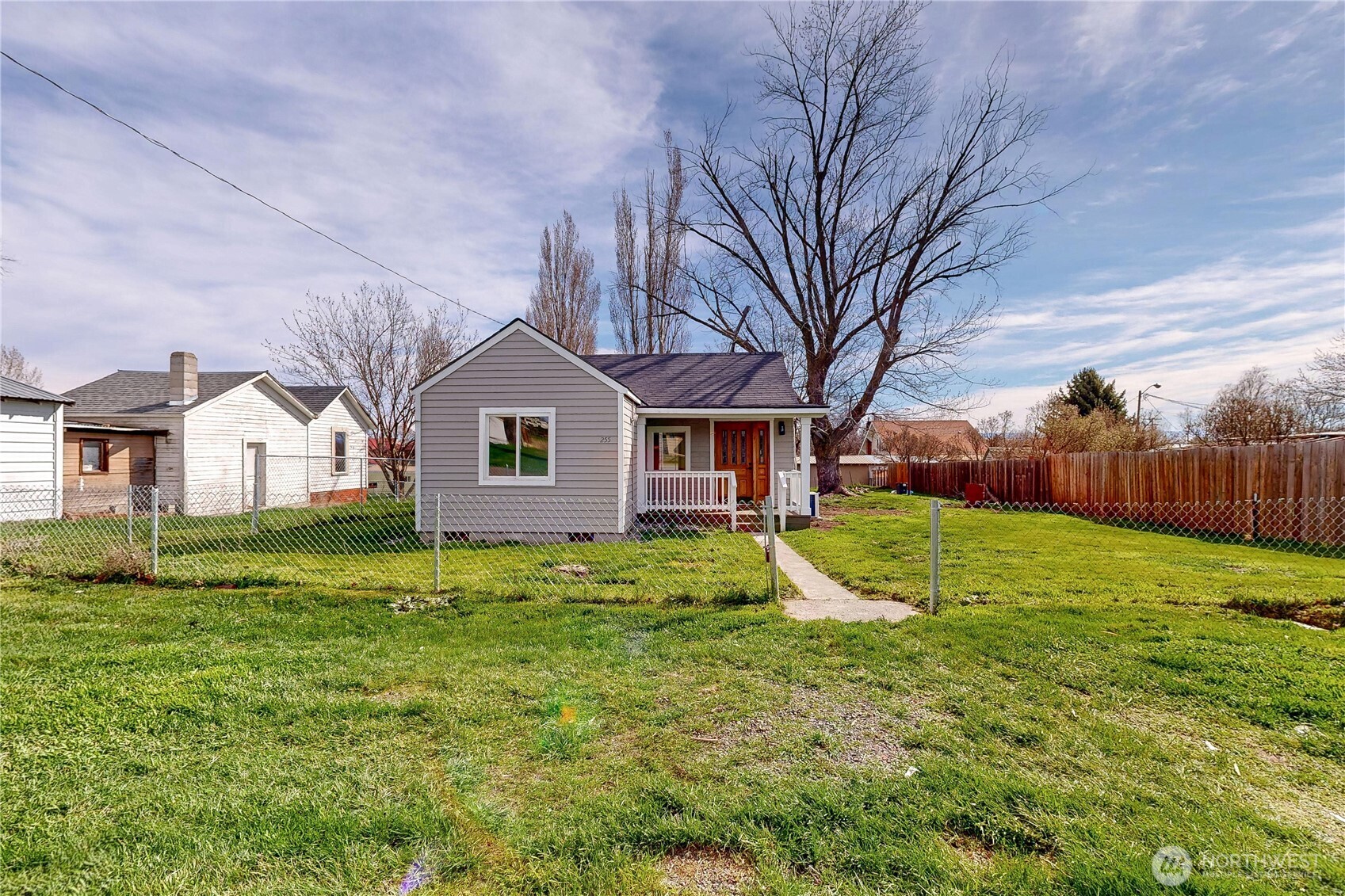 255 College Street Adams, OR 97810 - Photo 30 of 31 a view of a yard in front of a house with a large tree