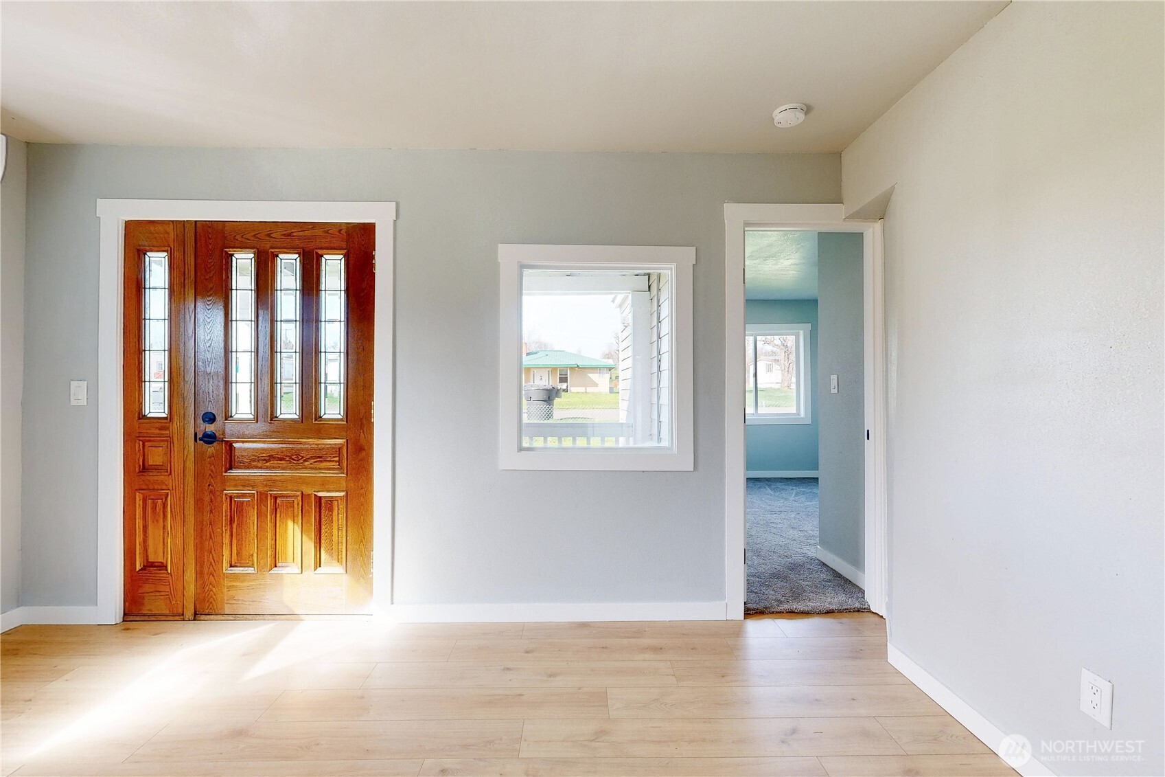 255 College Street Adams, OR 97810 - Photo 4 of 31 a view of an empty room with wooden floor and a window