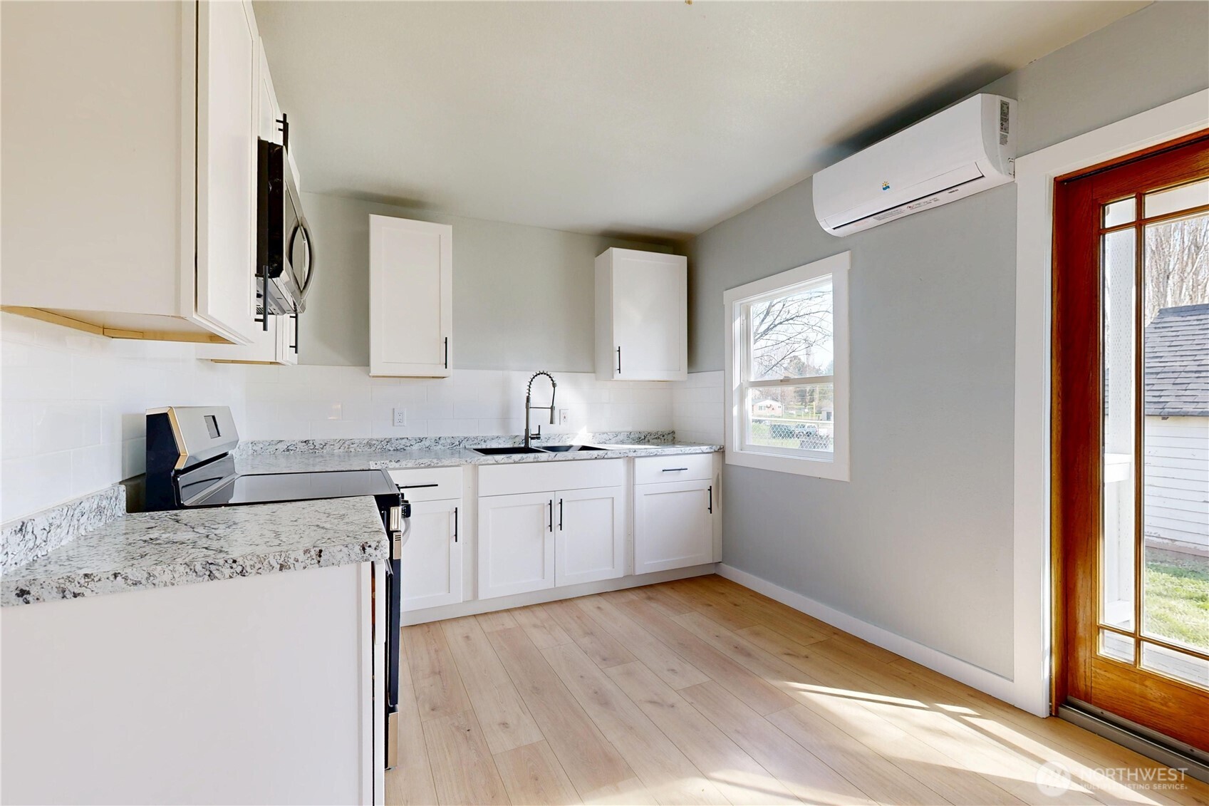 255 College Street Adams, OR 97810 - Photo 5 of 31 a kitchen with a stove a sink and a refrigerator