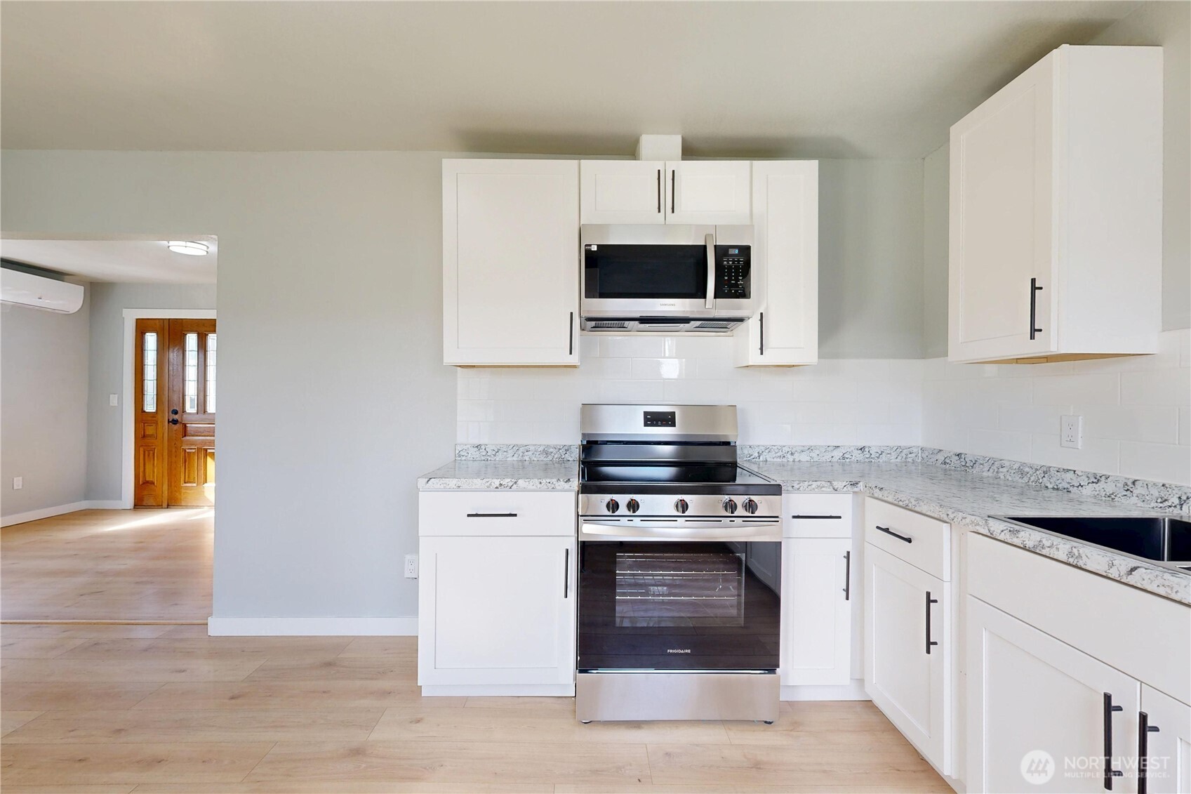 255 College Street Adams, OR 97810 - Photo 6 of 31 a kitchen with stainless steel appliances granite countertop a stove a sink and a microwave