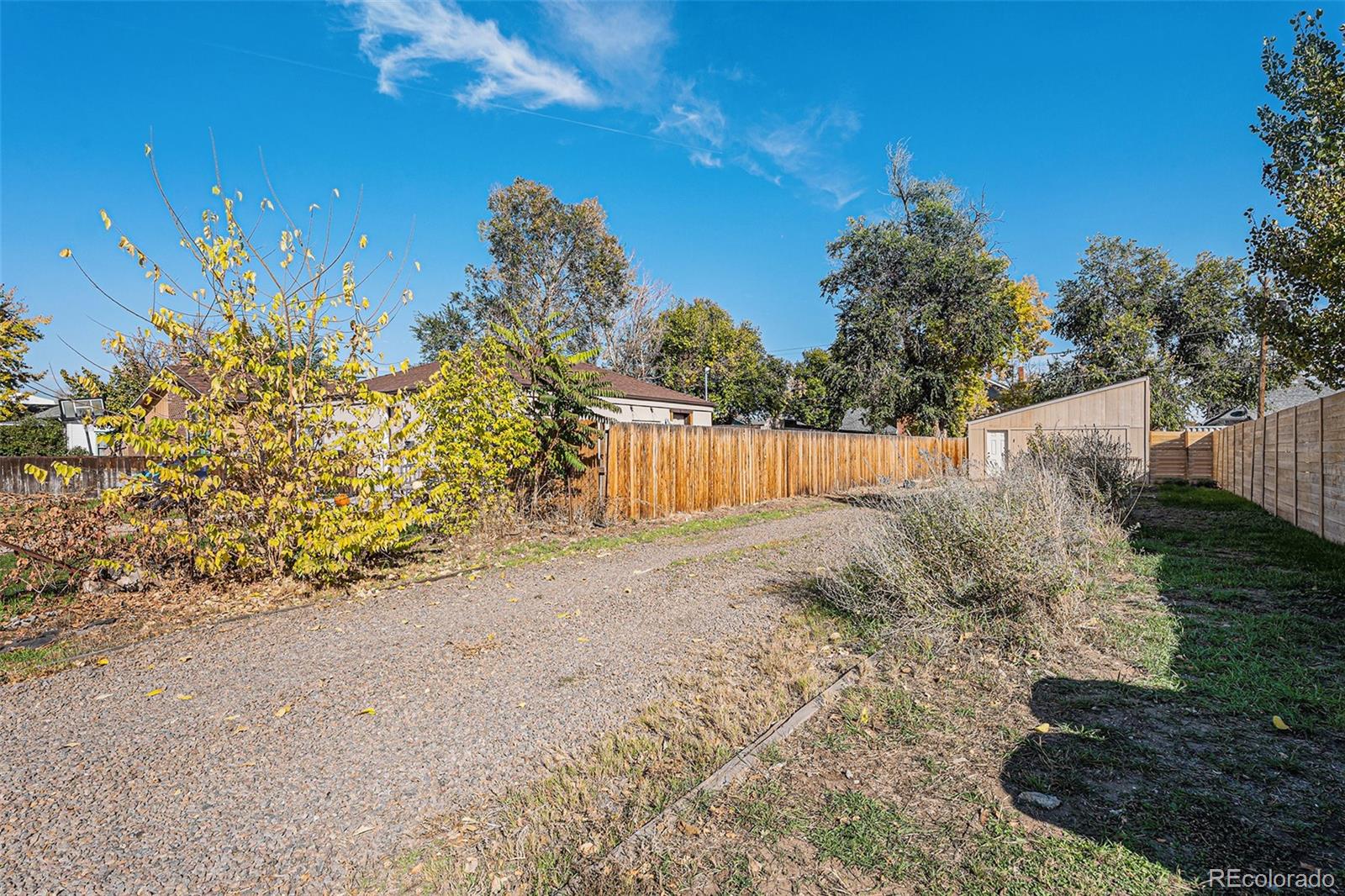 3976 South Acoma Street Englewood, CO 80110 - Photo 12 of 23 a backyard of a house with lots of green space