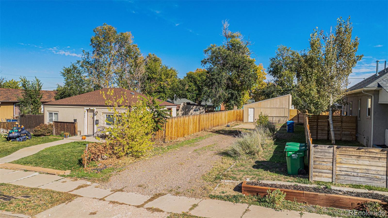 3976 South Acoma Street Englewood, CO 80110 - Photo 13 of 23 a view of a house with a yard