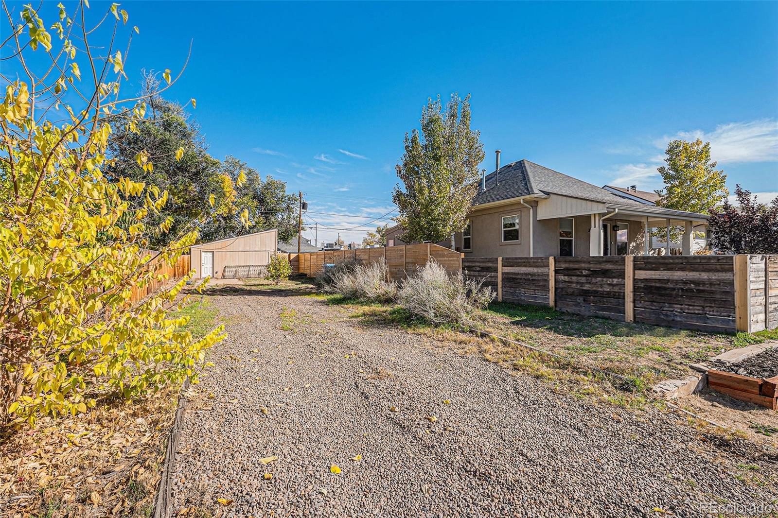 3976 South Acoma Street Englewood, CO 80110 - Photo 15 of 23 a view of a house with wooden fence