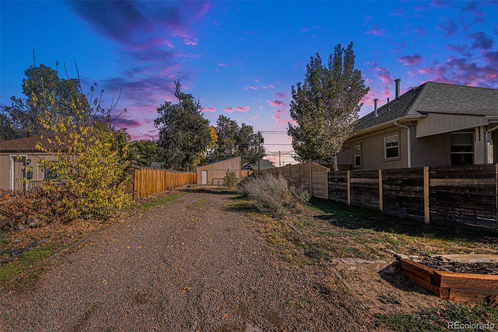 3976 South Acoma Street Englewood, CO 80110 - Photo 16 of 23 a view of a house with wooden fence