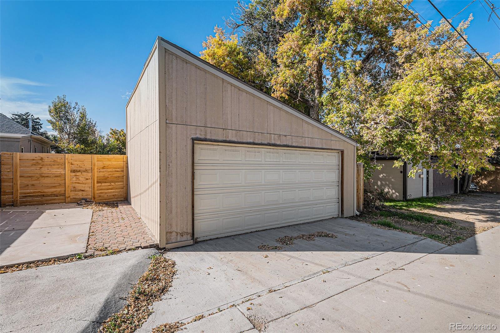 3976 South Acoma Street Englewood, CO 80110 - Photo 5 of 23 a front view of a house with a garage