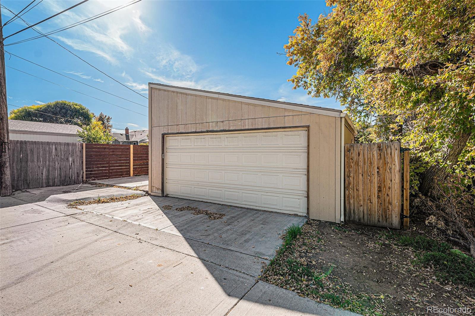 3976 South Acoma Street Englewood, CO 80110 - Photo 6 of 23 a view of backyard of house with garage