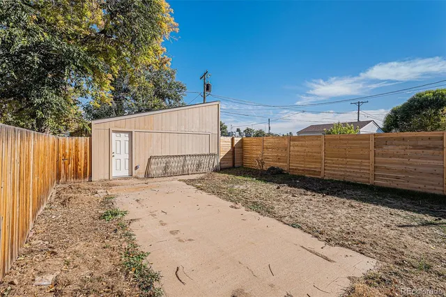 a backyard of a house with lots of green space