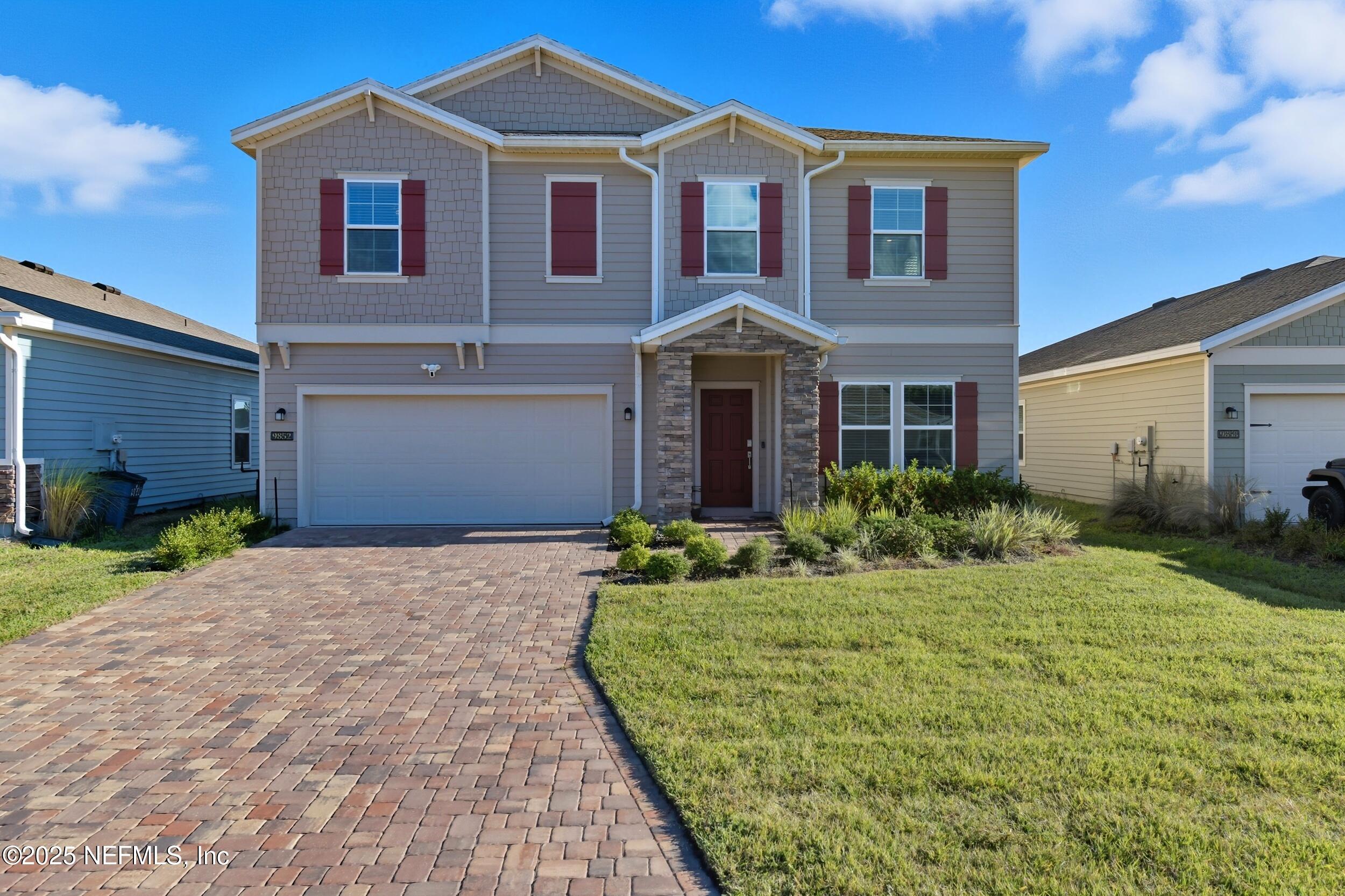 a front view of a house with a yard