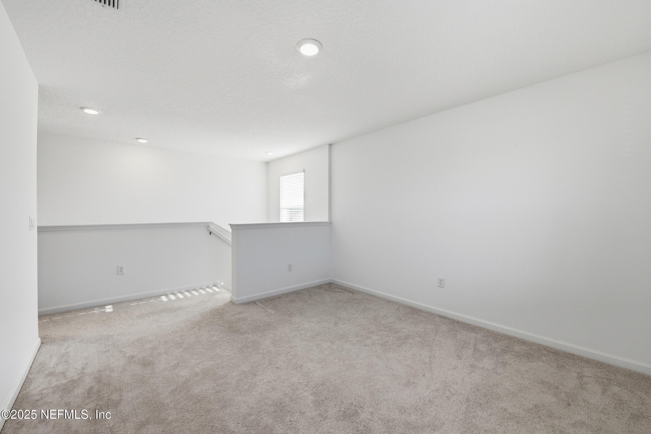 9852 Lemon Balm Way Jacksonville, FL 32219 - Photo 11 of 45 an empty room with windows