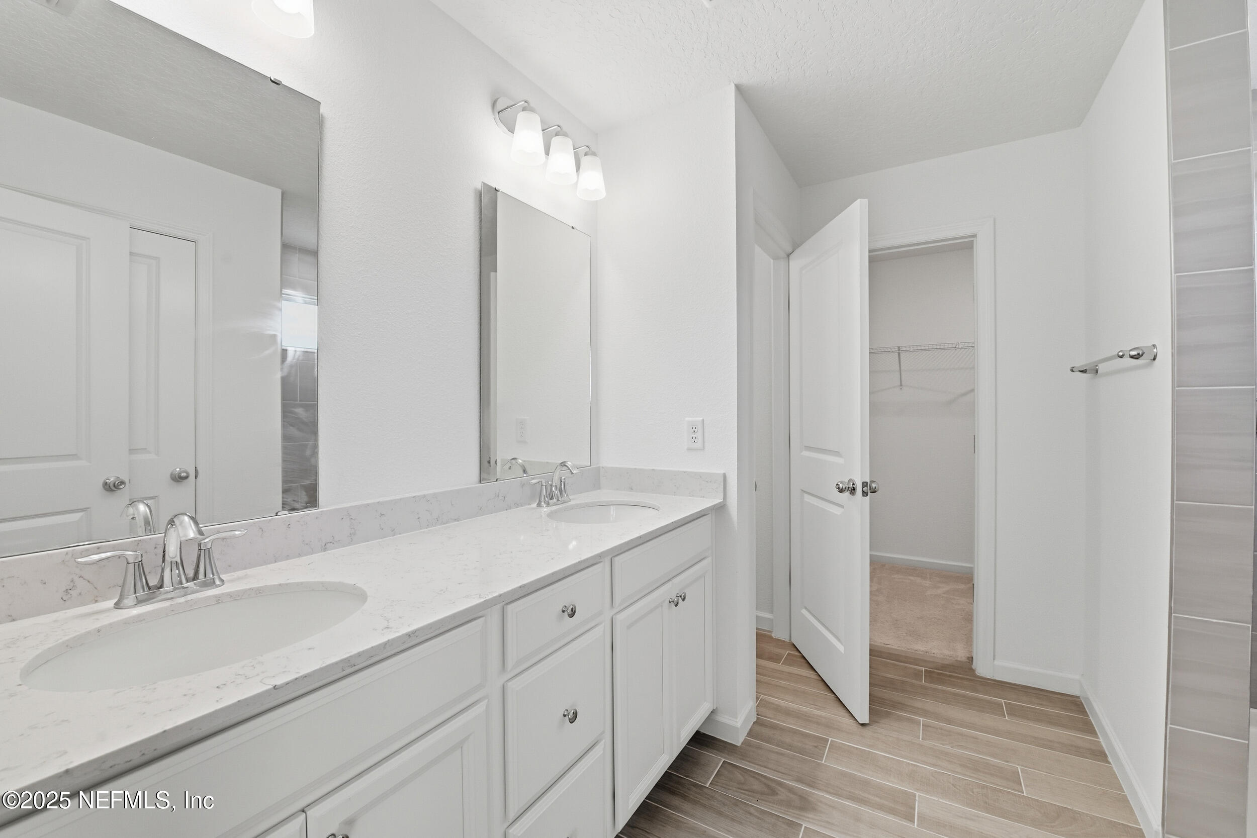 9852 Lemon Balm Way Jacksonville, FL 32219 - Photo 14 of 45 a bathroom with a granite countertop sink double and mirror