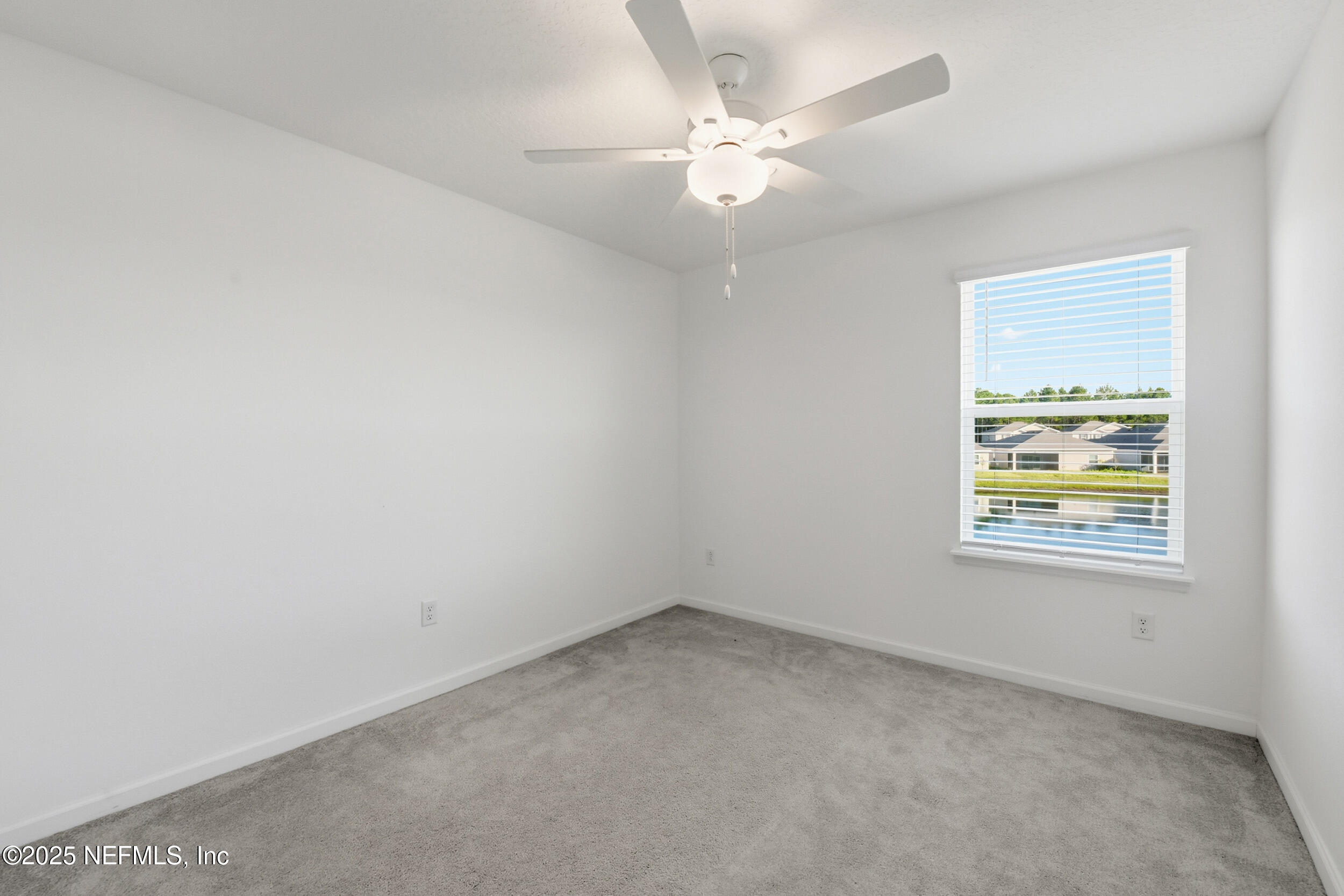 9852 Lemon Balm Way Jacksonville, FL 32219 - Photo 19 of 45 an empty room with a window