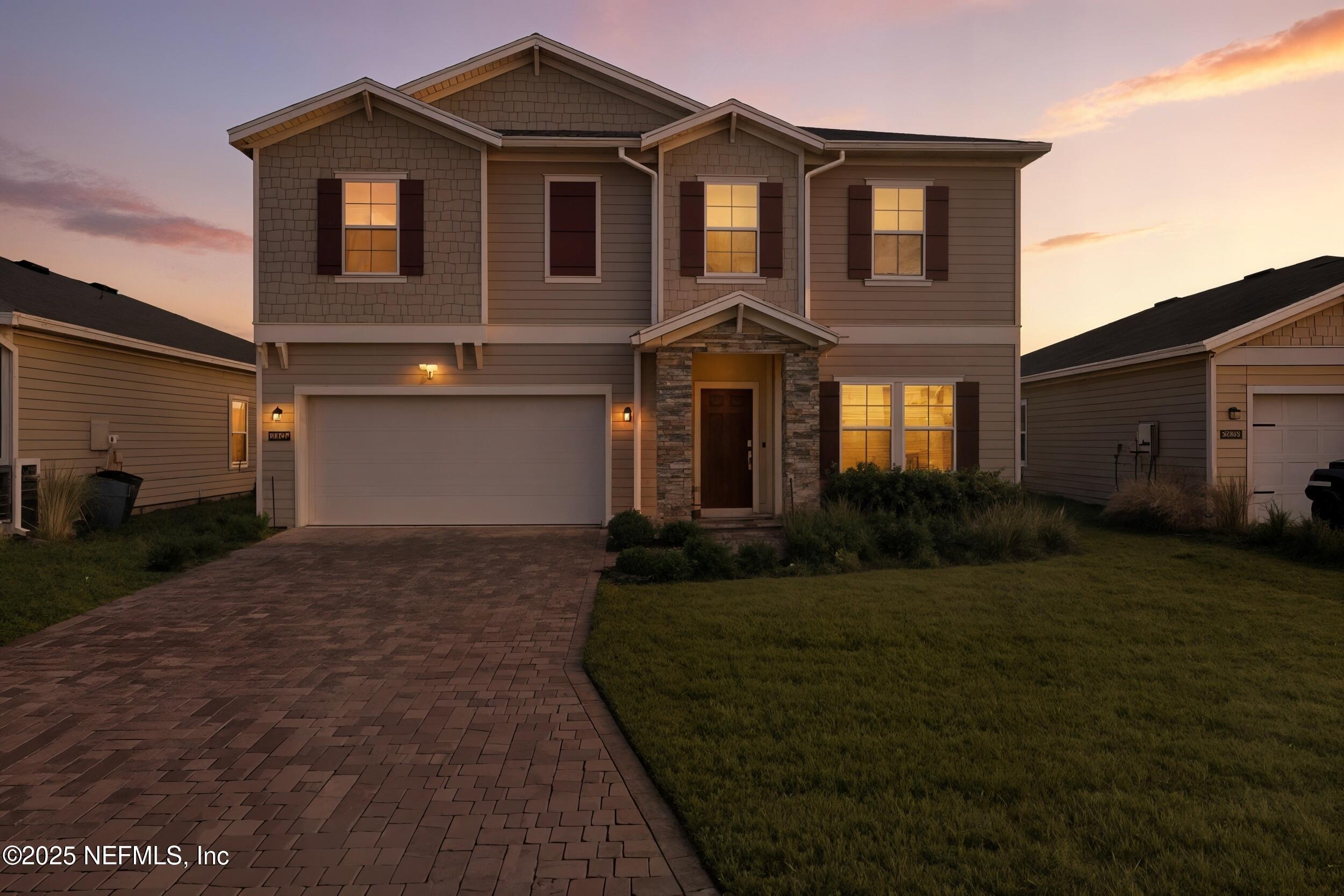 9852 Lemon Balm Way Jacksonville, FL 32219 - Photo 2 of 45 a front view of a house with a yard