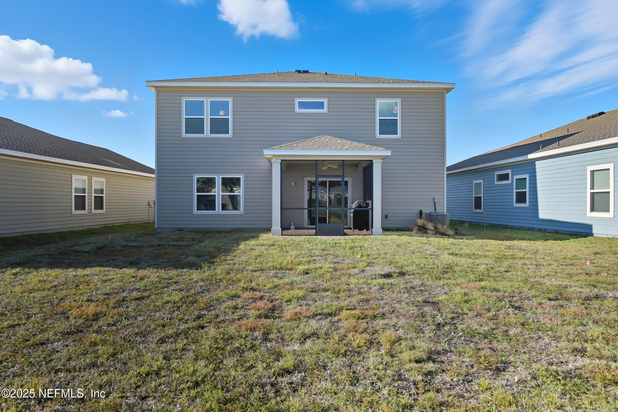 9852 Lemon Balm Way Jacksonville, FL 32219 - Photo 25 of 45 a front view of a house with garden