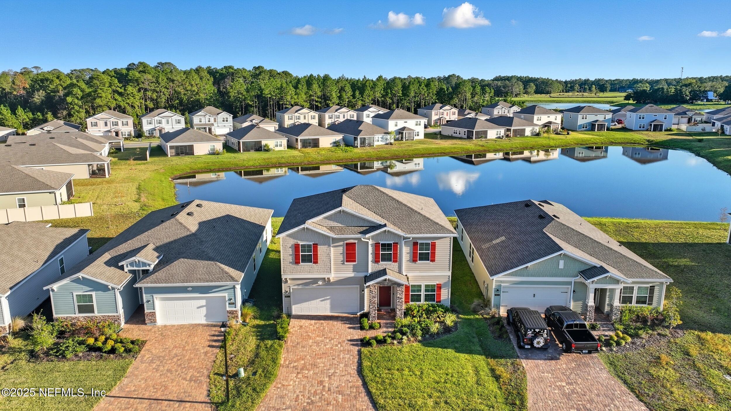 9852 Lemon Balm Way Jacksonville, FL 32219 - Photo 26 of 45 an aerial view of a house with swimming pool patio and outdoor seating