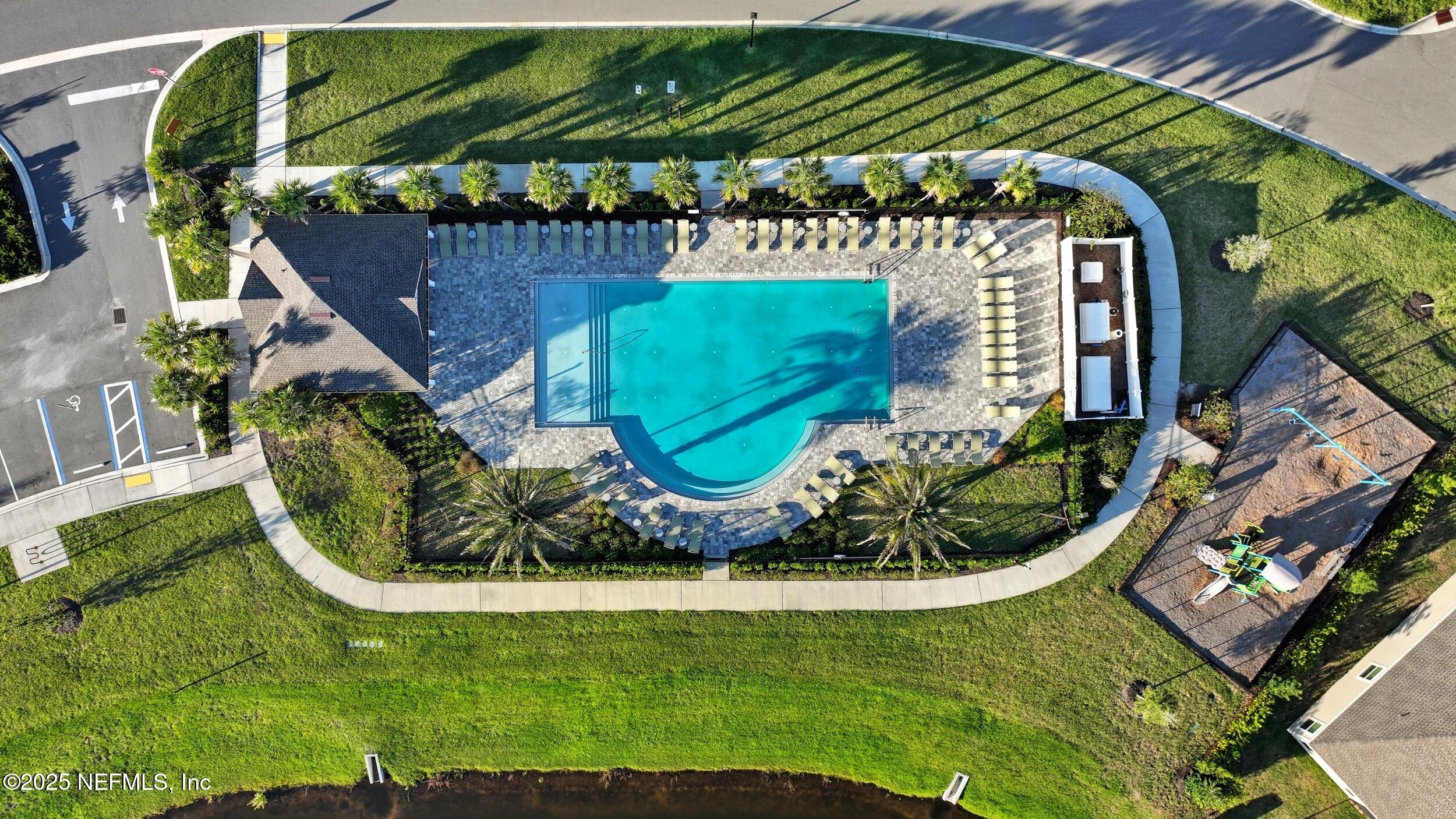 9852 Lemon Balm Way Jacksonville, FL 32219 - Photo 32 of 45 an aerial view of a house with a garden and trees