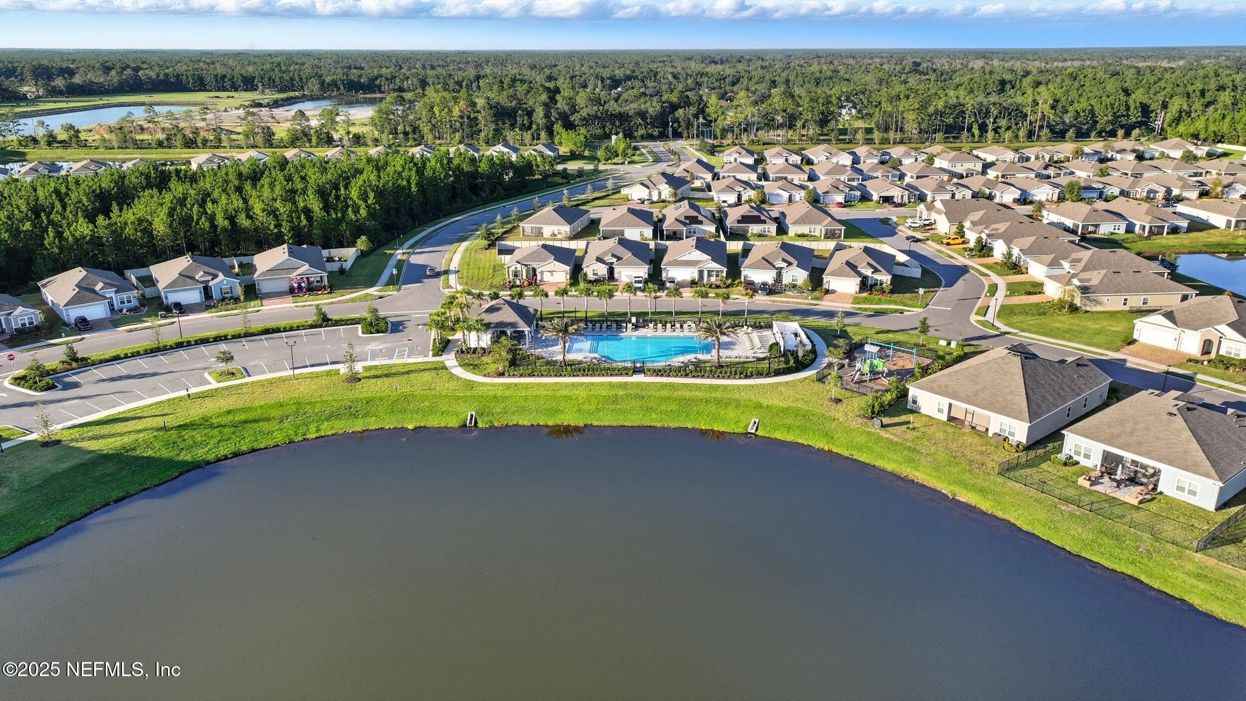 9852 Lemon Balm Way Jacksonville, FL 32219 - Photo 44 of 45 a view of a lake with a city