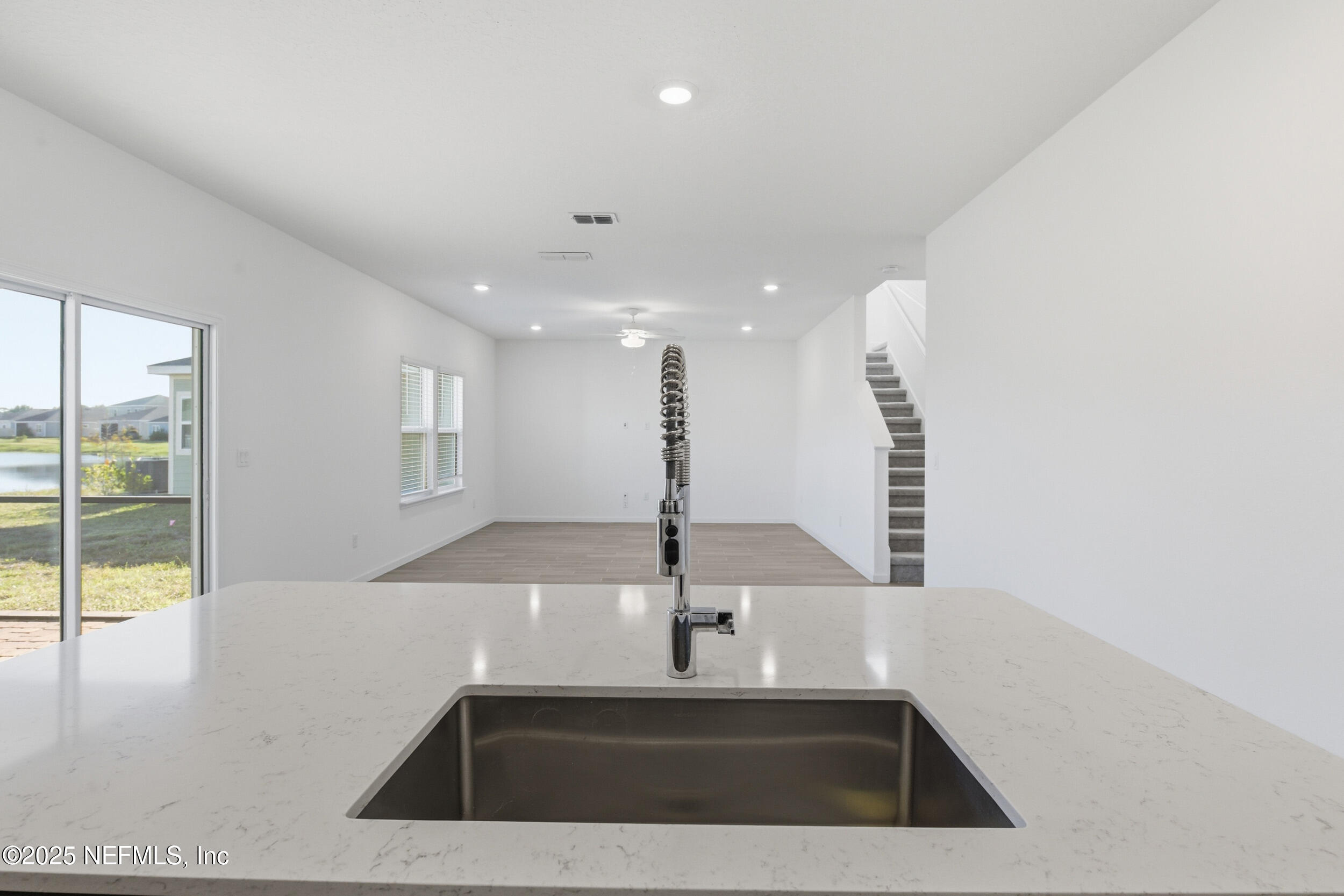 9852 Lemon Balm Way Jacksonville, FL 32219 - Photo 5 of 45 a view of a kitchen with a sink and a window