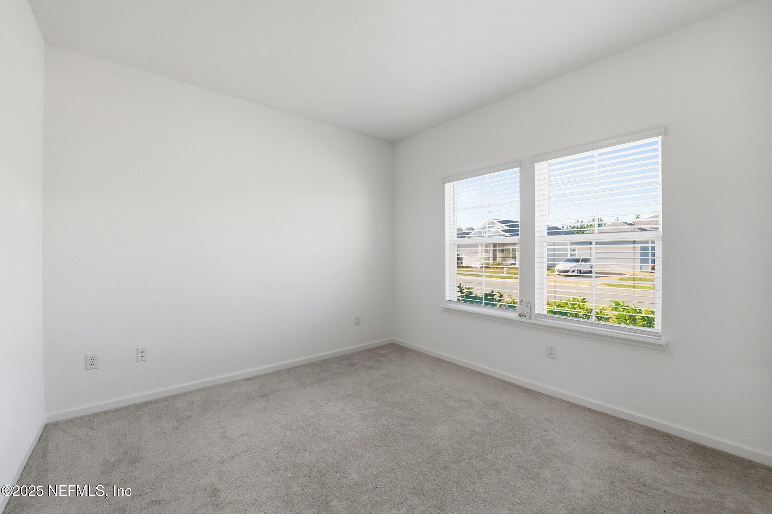 9852 Lemon Balm Way Jacksonville, FL 32219 - Photo 8 of 45 an empty room with a window