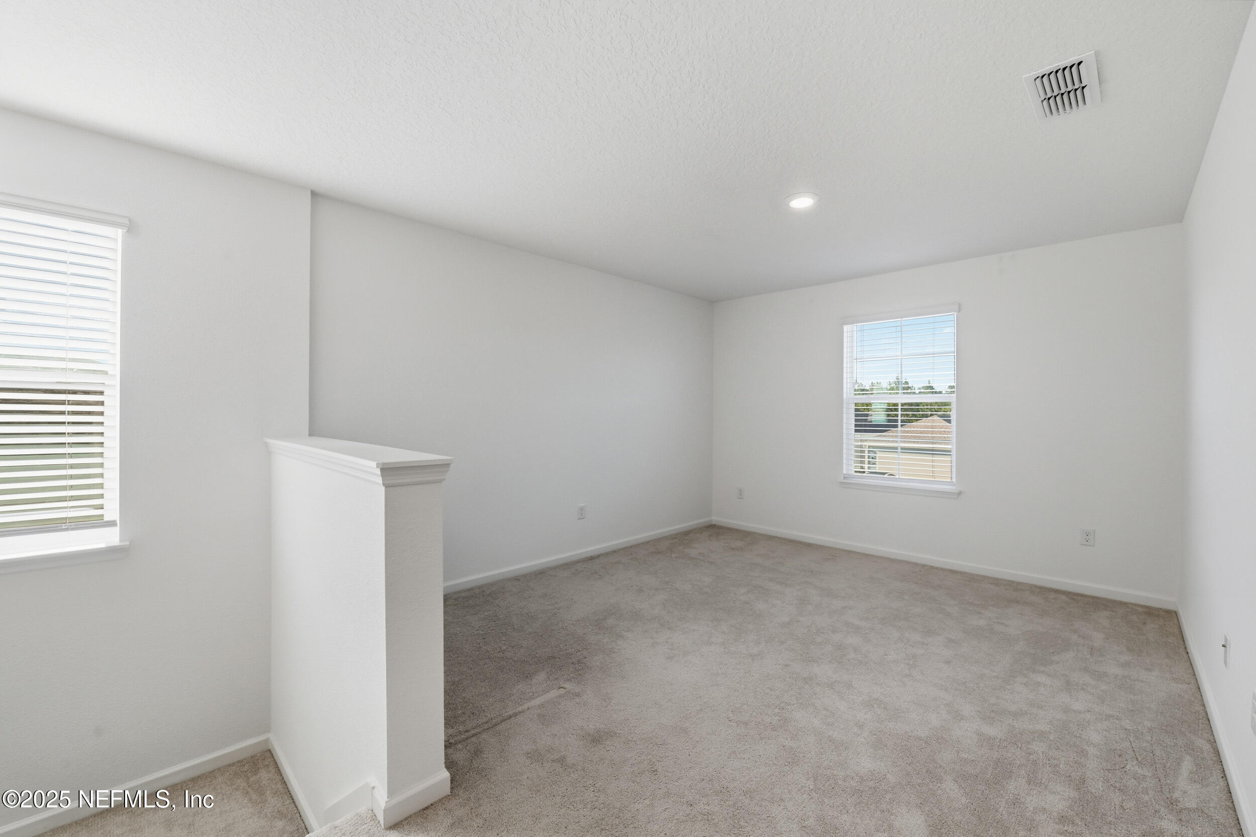 9852 Lemon Balm Way Jacksonville, FL 32219 - Photo 10 of 45 an empty room with a window