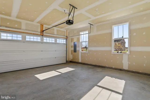 a bathroom with a sink a toilet and a window