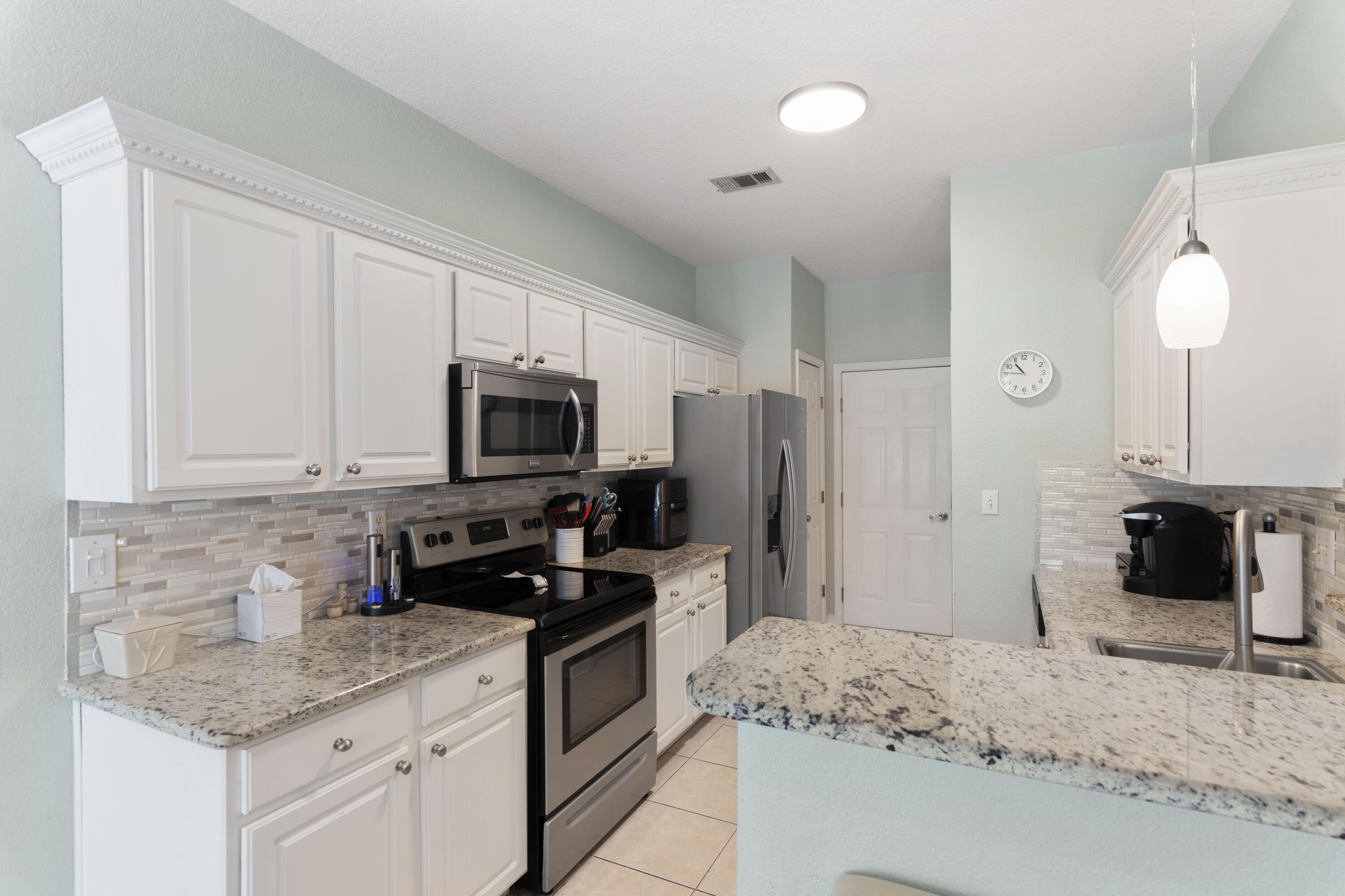 159 Mariner Way Miramar Beach, FL 32550 - Photo 14 of 47 a kitchen with a sink stove and refrigerator