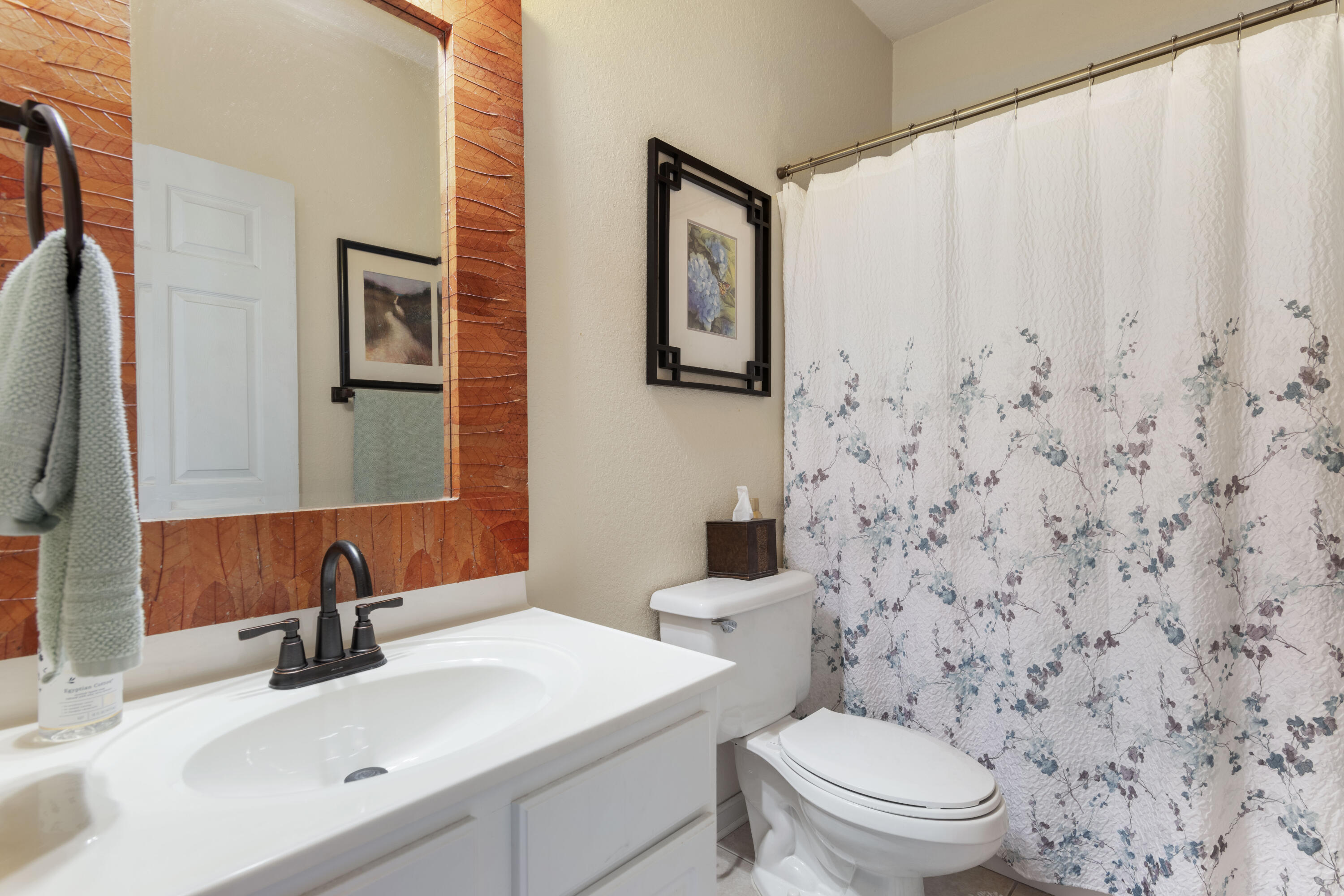 159 Mariner Way Miramar Beach, FL 32550 - Photo 22 of 47 a bathroom with a toilet a sink and a mirror