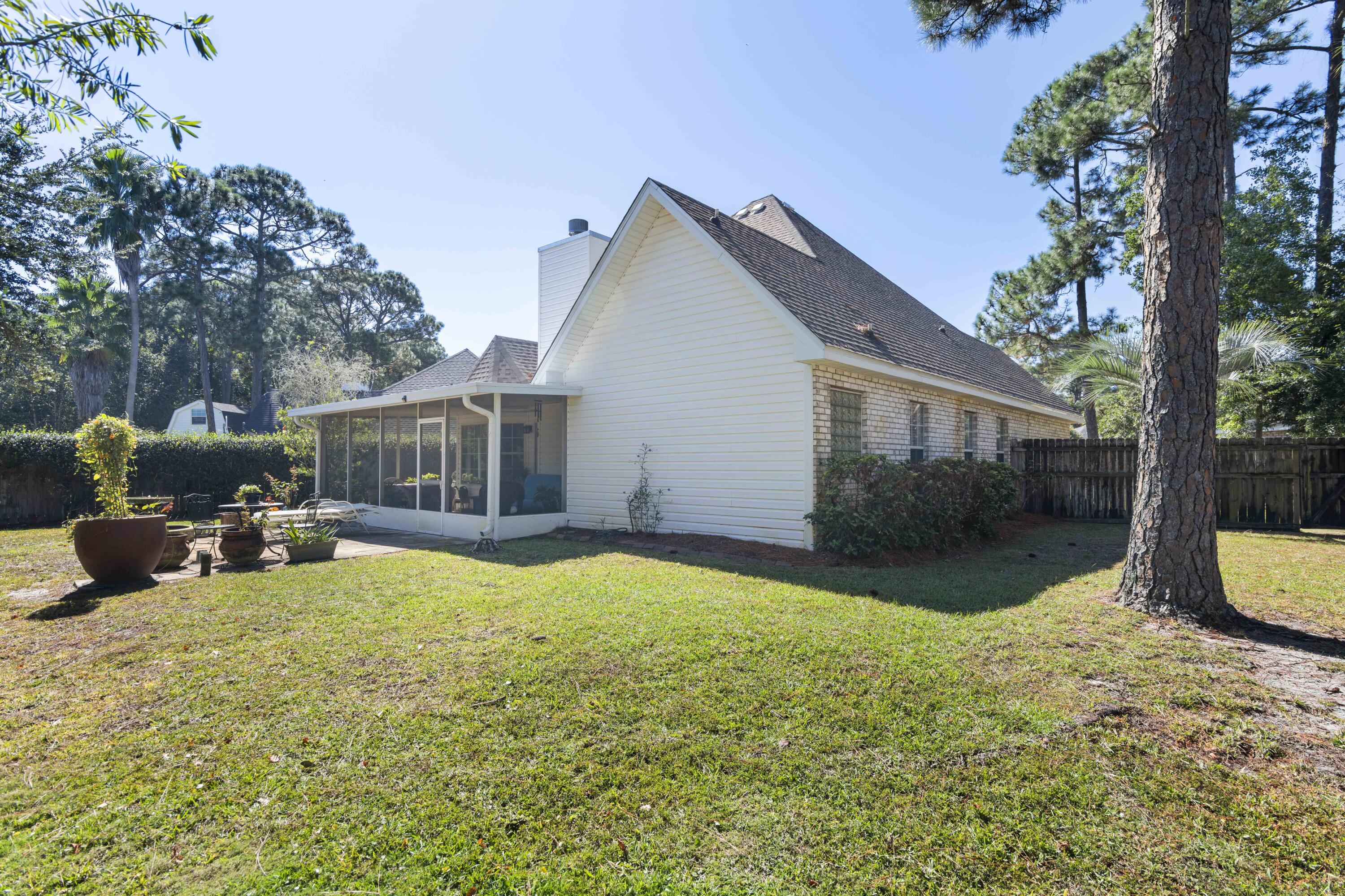 159 Mariner Way Miramar Beach, FL 32550 - Photo 30 of 47 a view of a house with backyard and sitting area