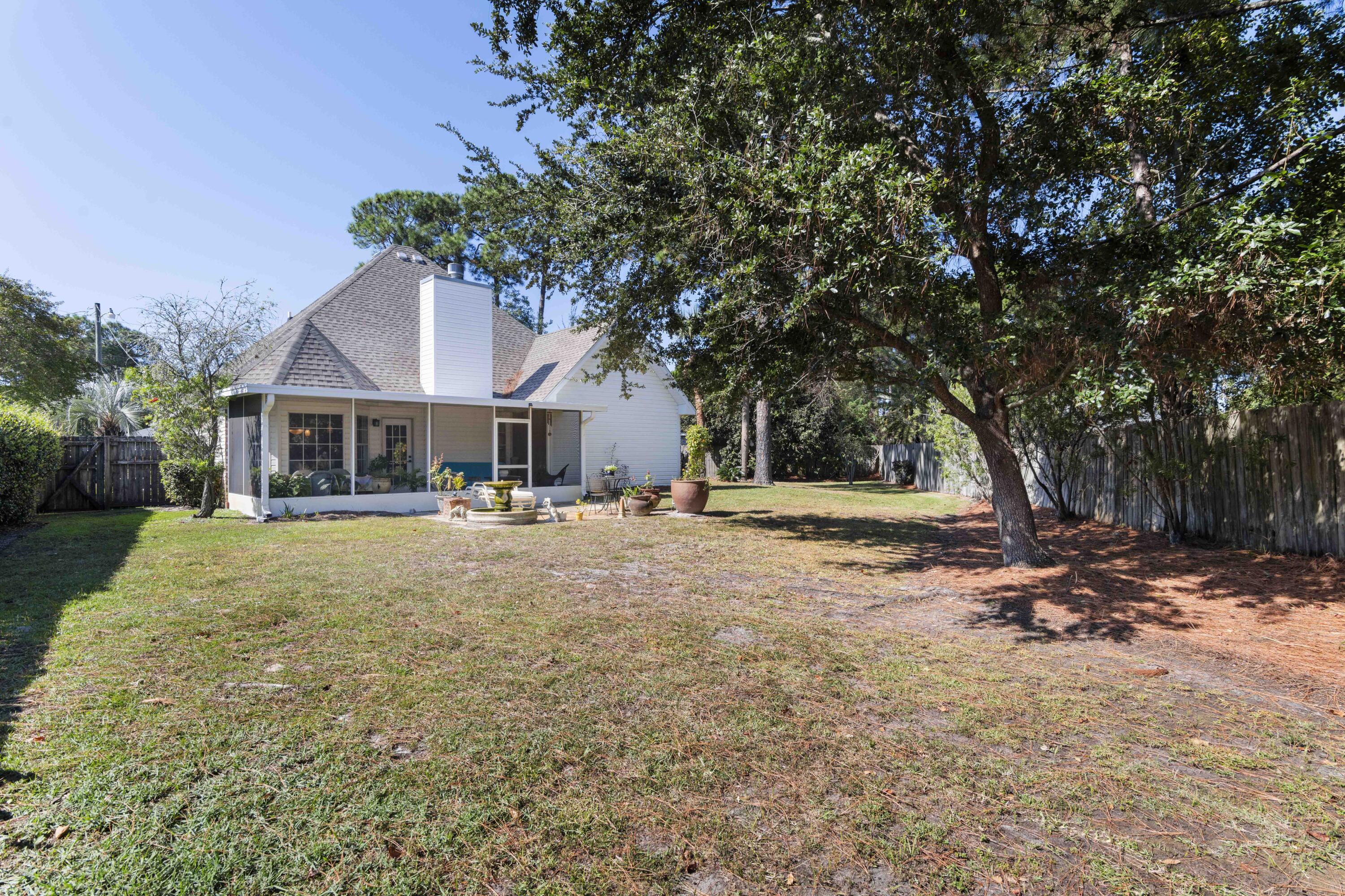 159 Mariner Way Miramar Beach, FL 32550 - Photo 31 of 47 a backyard of a house with table and chairs