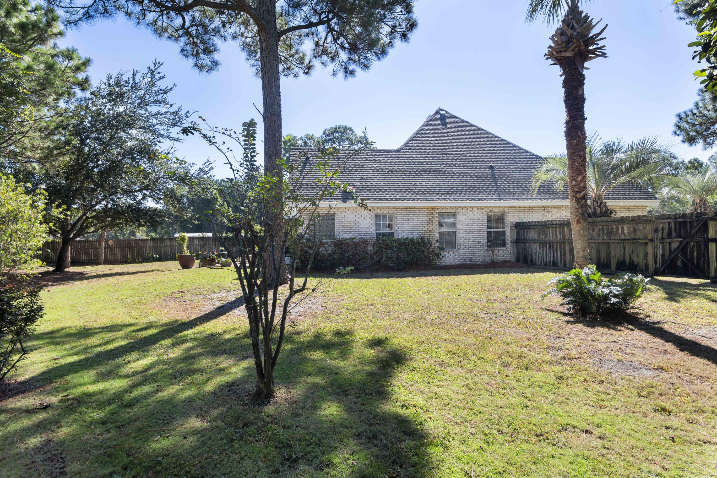 159 Mariner Way Miramar Beach, FL 32550 - Photo 32 of 47 a view of a house with backyard and tree
