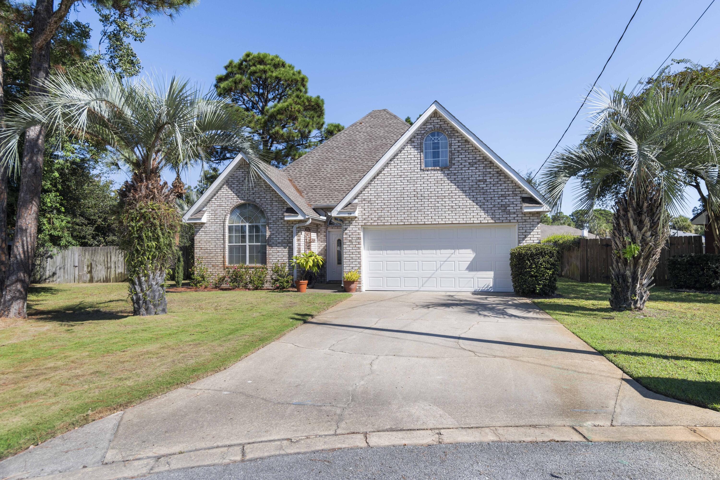 159 Mariner Way Miramar Beach, FL 32550 - Photo 33 of 47 a front view of a house with a yard and garage