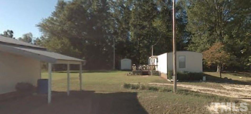 a house with trees in the background