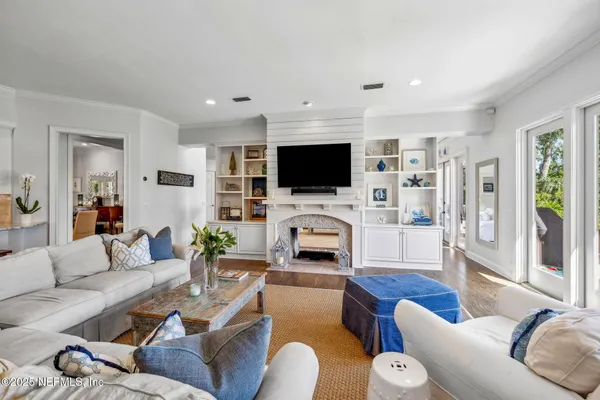 a kitchen with stainless steel appliances granite countertop a sink and a refrigerator