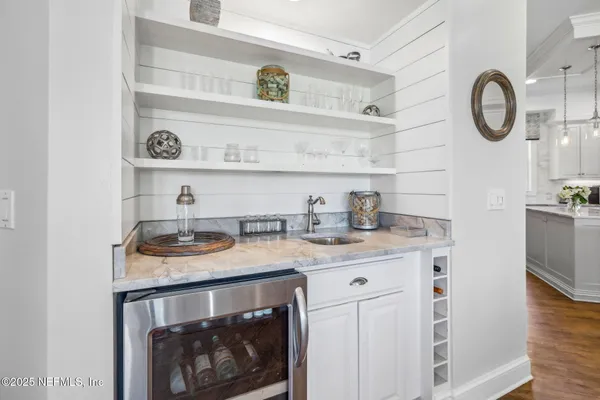 a bedroom with a bed couch and a dresser