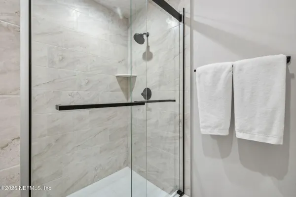 a bed room with a bed and a window