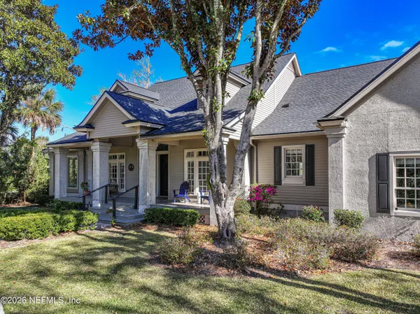 a backyard of a house with outdoor seating