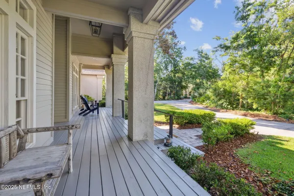 a living room with furniture fireplace and a large window