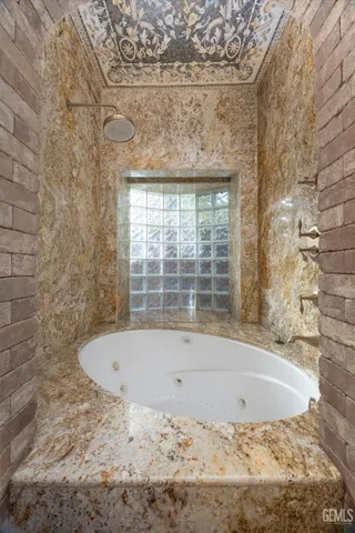 a bedroom with bed and window