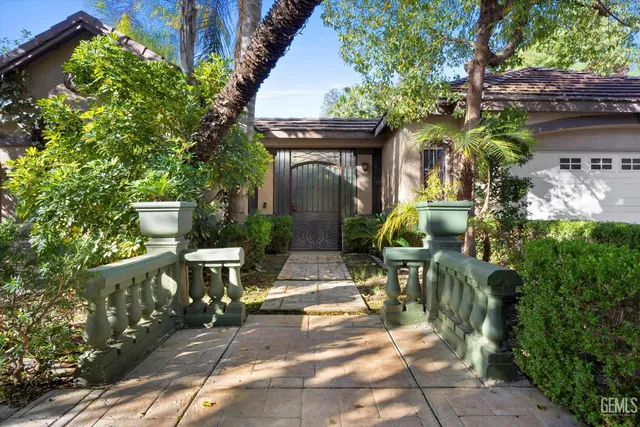 a view of a chairs and table in backyard