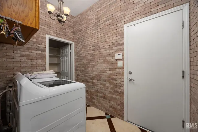 a kitchen with a sink cabinets and appliances