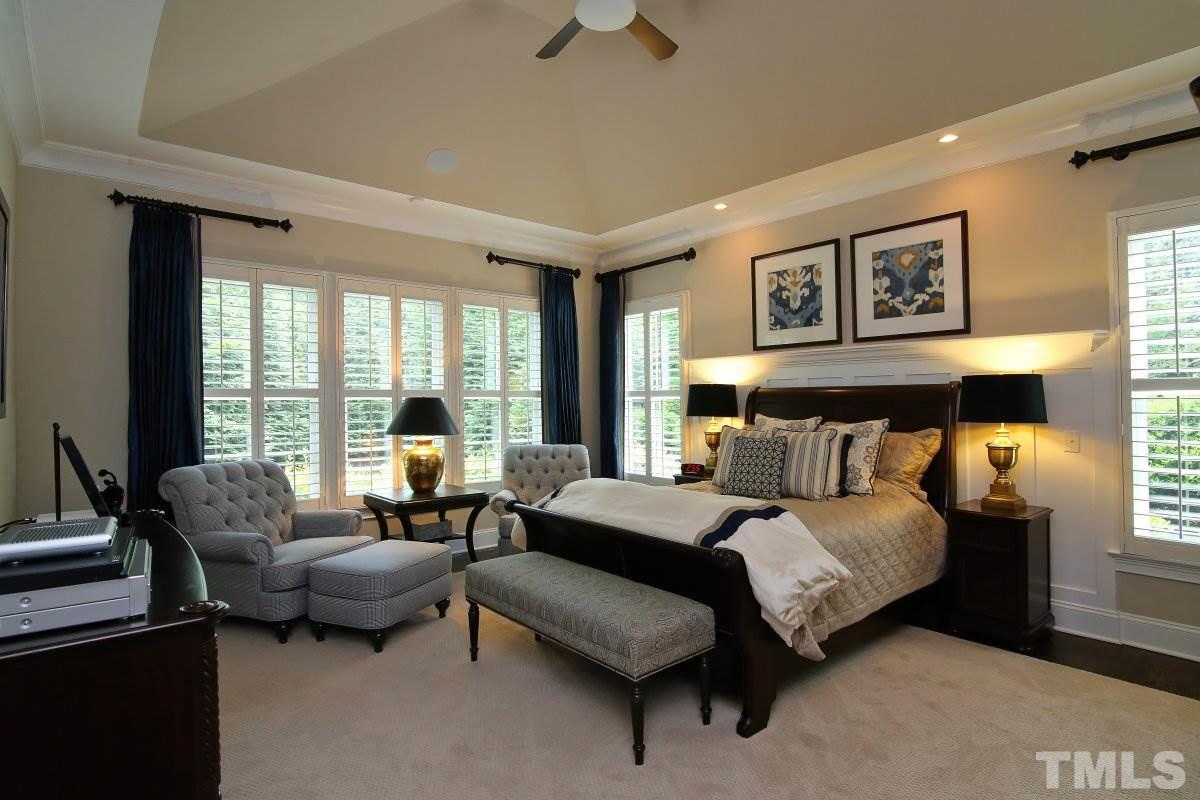 4106 English Garden Way Raleigh, NC 27612 - Photo 13 of 25 Large master bedroom with hardwood flooring.