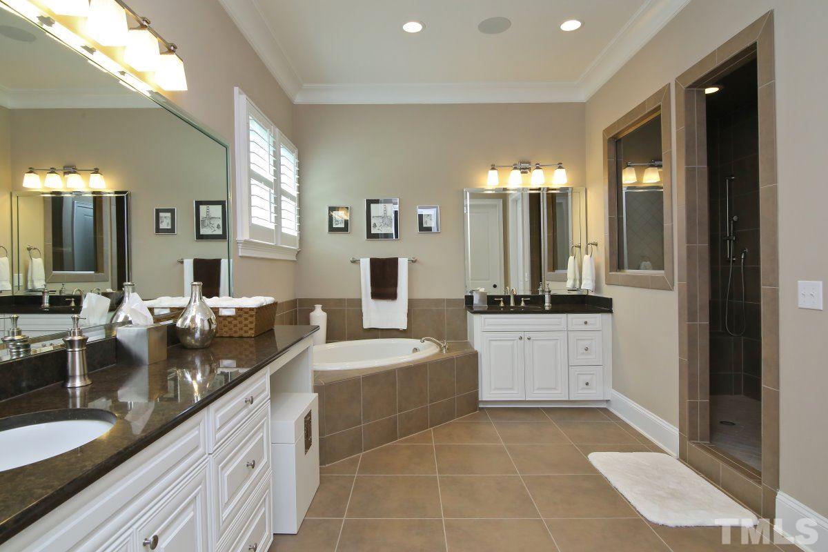 4106 English Garden Way Raleigh, NC 27612 - Photo 14 of 25 Double vanities, soaking tub and large walk-in shower with bench.
